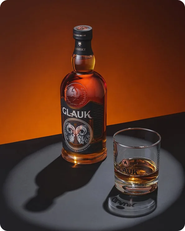 Glauk Albanian whisky with a poured glass
